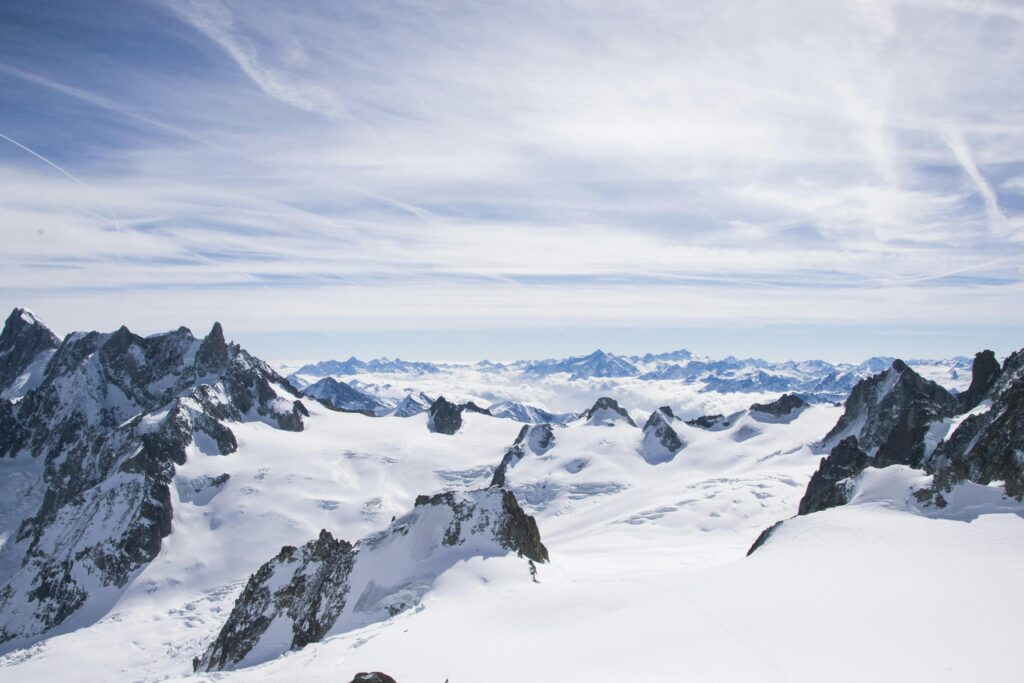 Breathtaking view of Mont Blanc showcasing its icy, rugged peaks under a blue sky